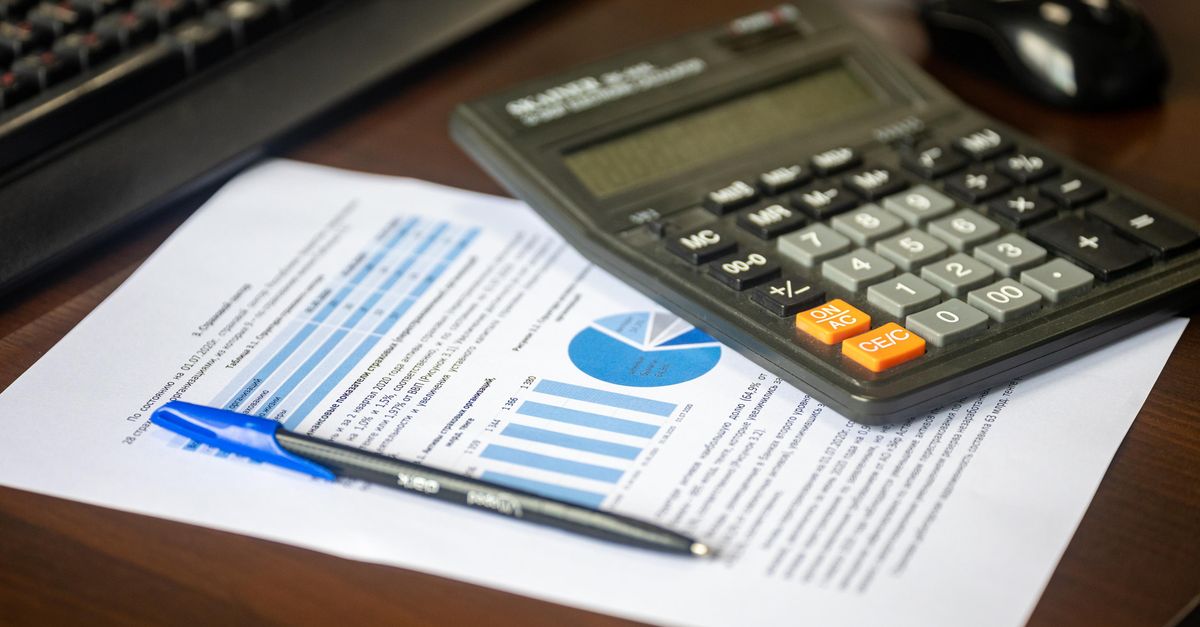 Calculator and financial documents on a desk