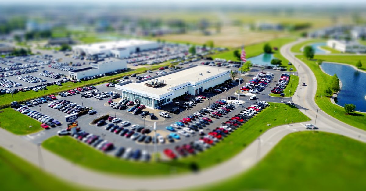 Rows of cars parked on a dealership lot