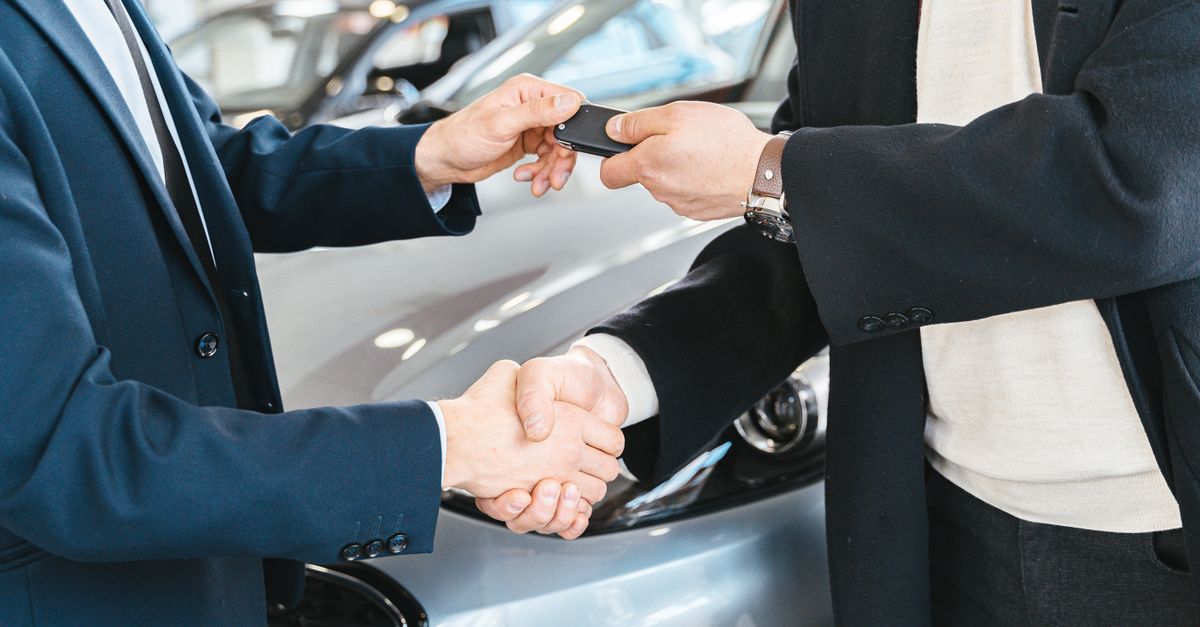 Handing over car keys after a sale